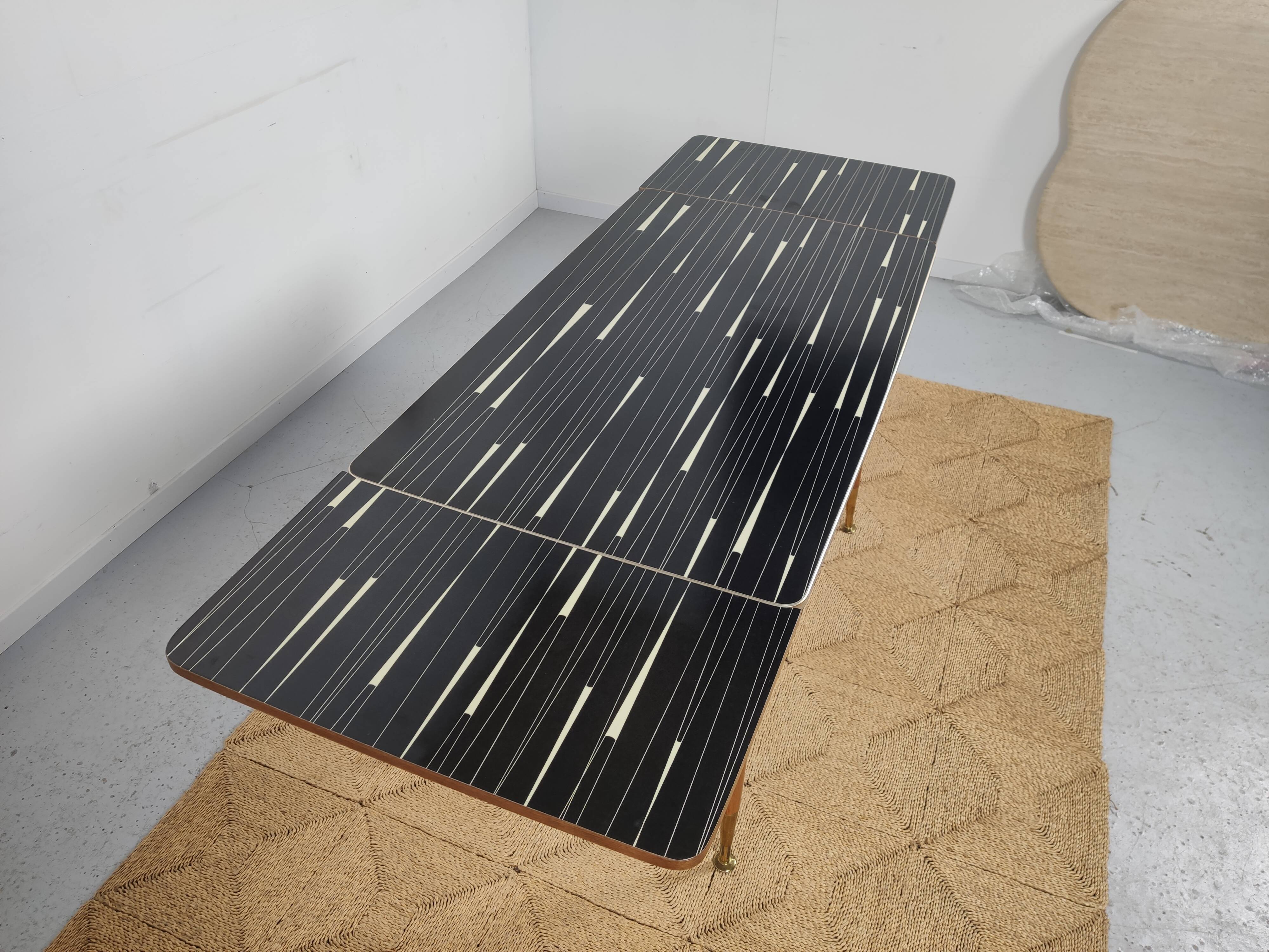 Adjustable vintage table with formica extension cords