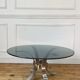 Round smoked glass coffee table from the 70s