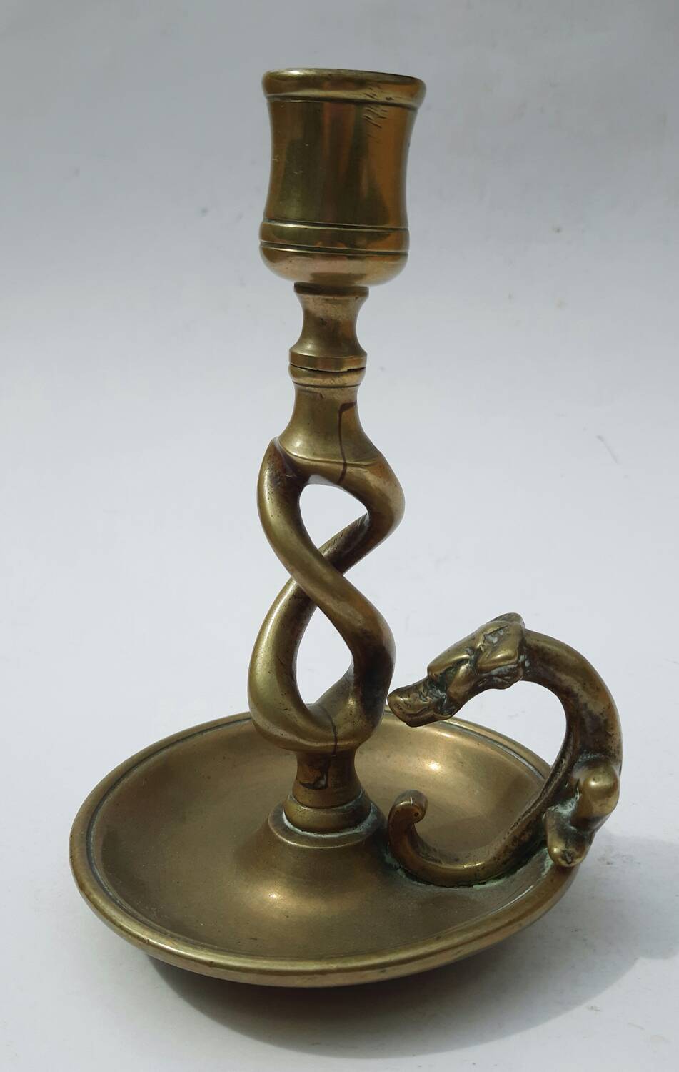 Antique bronze candlestick with dragon-shaped handle from the 17th century