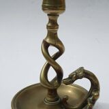 Antique bronze candlestick with dragon-shaped handle from the 17th century