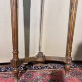 Half-moon console in Louis XVI style made of carved wood.