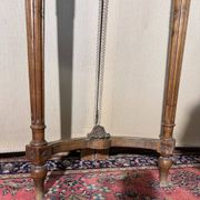 Half-moon console in Louis XVI style made of carved wood.