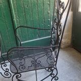 Pair of black wrought iron armchairs