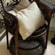 Emmanuelle rattan armchair