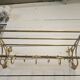 Wall-mounted coat rack with brass hat rack