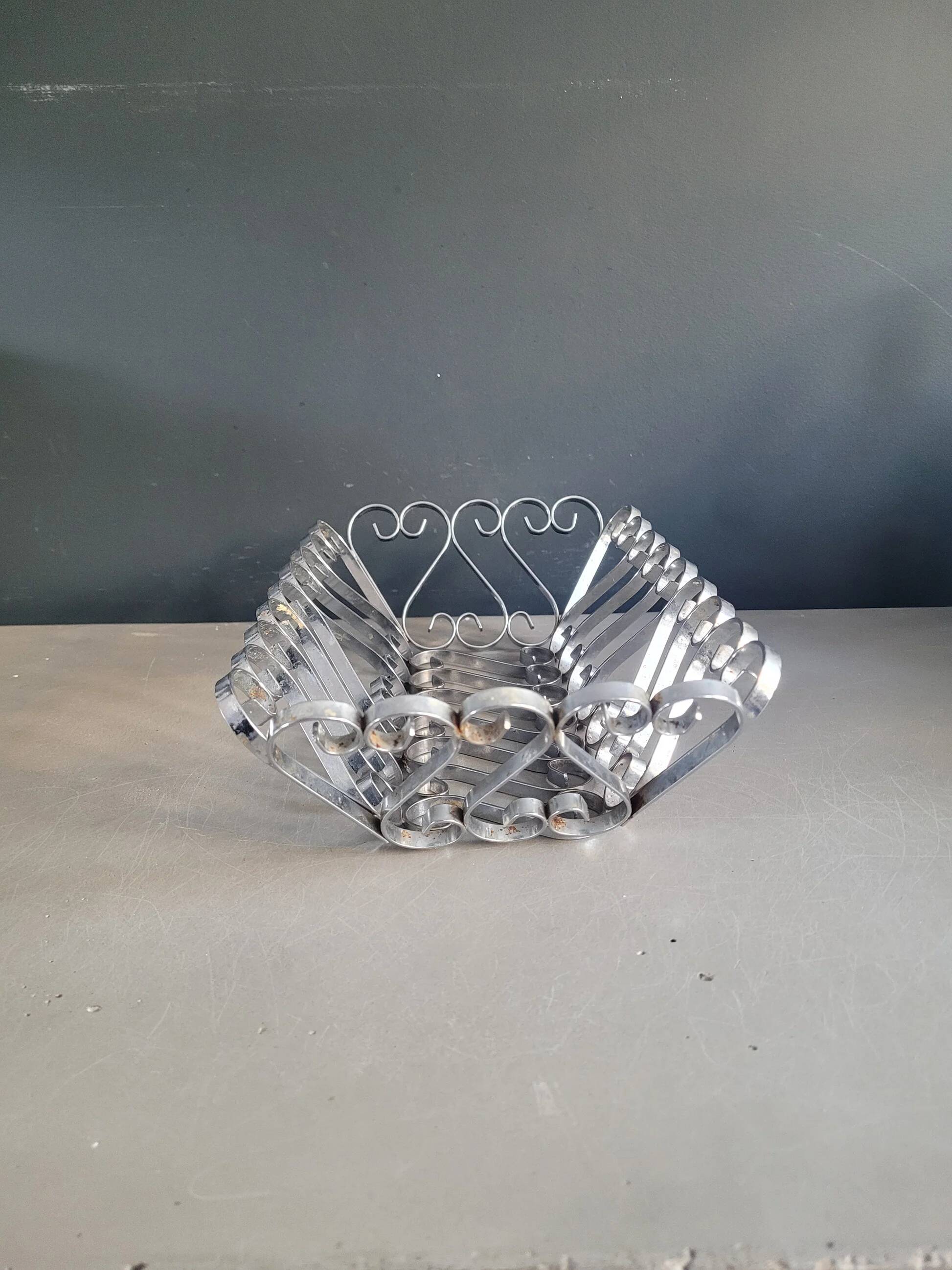 Vintage bread basket in forged chrome-plated metal