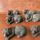 12 elongated brown bear-shaped knife rests