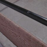 Black metal and rattan bed frame