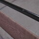 Black metal and rattan bed frame