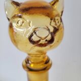 Zoomorphic carafe in amber glass