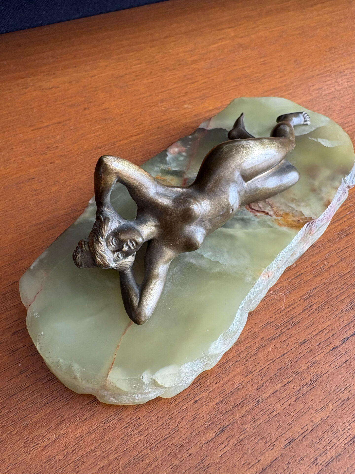 Art Deco female sculpture in bronze with onyx base.