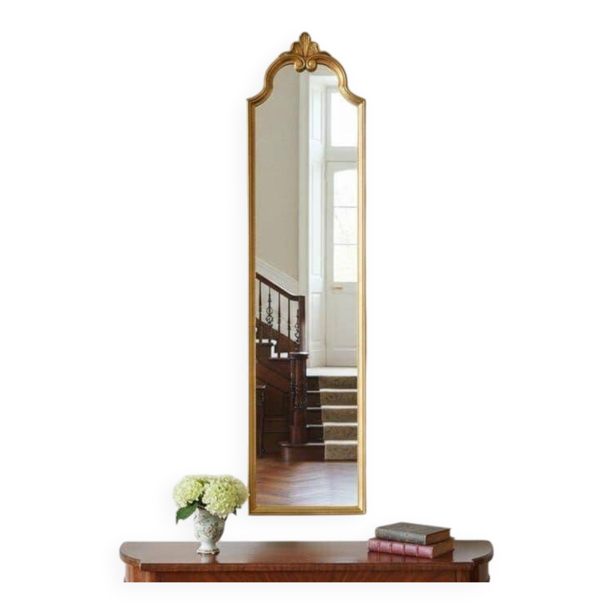 Narrow and tall antique mirror, adorned with golden patterns.