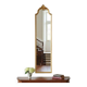 Narrow and tall antique mirror, adorned with golden patterns.