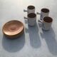 4 ceramic cups and saucers