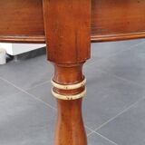 Round cherry wood table with extensions