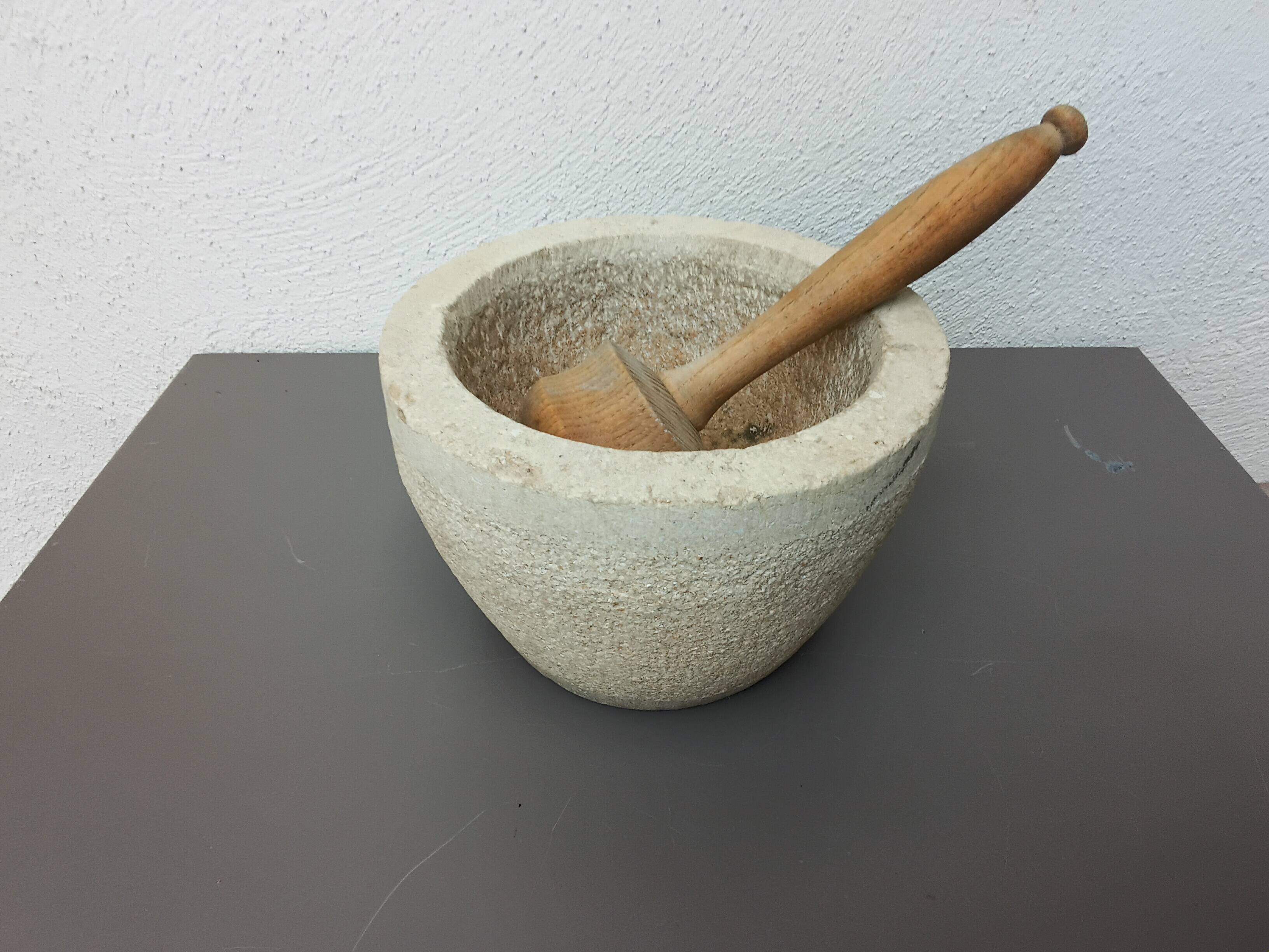 Stone mortar with wooden pestle