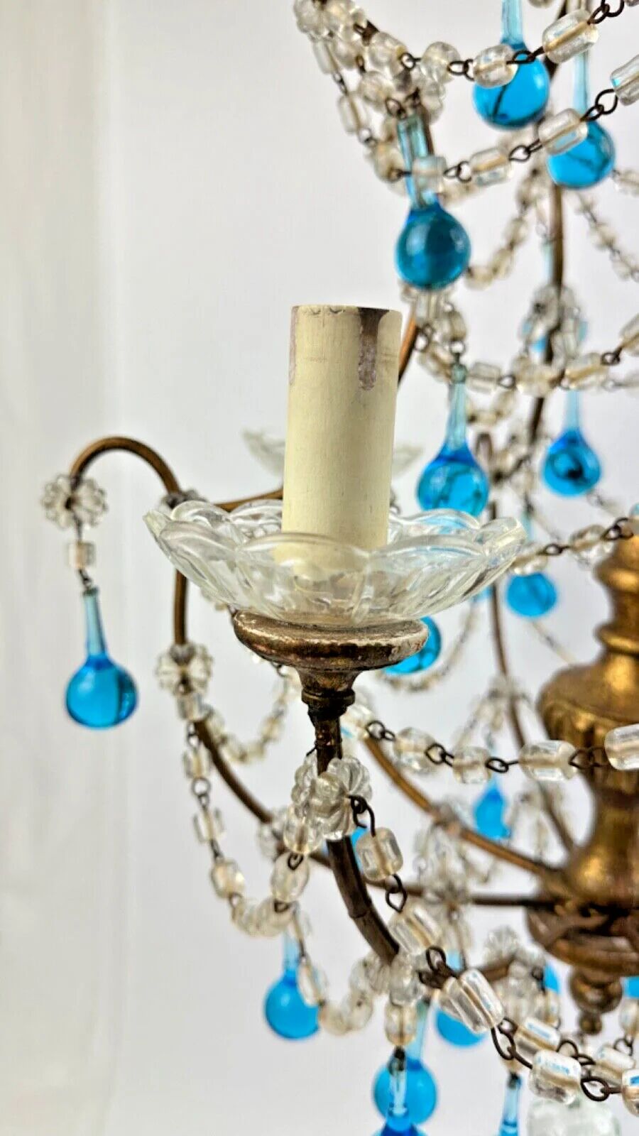 Italian chandelier with blue beads and gilded wood.