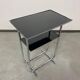 Bauhaus side table with a black glass top