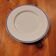 Limoges porcelain plate with a blue speckled rim.