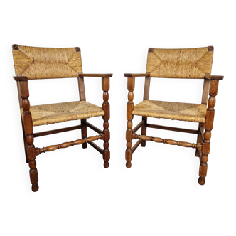 Pair of French primitive rush chairs with armrests, 1930s
