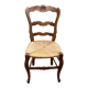 Louis XV 18th century solid wood dining chair with a straw seat.