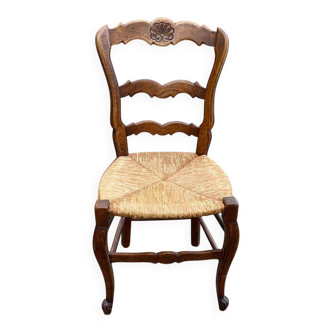 Louis XV 18th century solid wood dining chair with a straw seat.