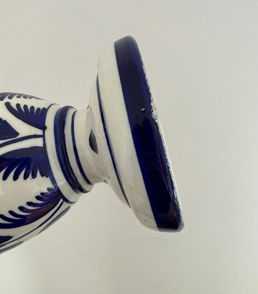 white amphora-style vase with hand-painted blue patterns
