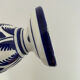white amphora-style vase with hand-painted blue patterns