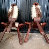 Pair of brutalist tripod chairs in wood and cowhide
