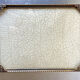 Metal frame in gold colored brass