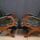 Pair of English Chesterfield armchairs in leather and solid wood