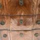 Transitional style chest of drawers in rosewood and amaranth veneer, 20th century.