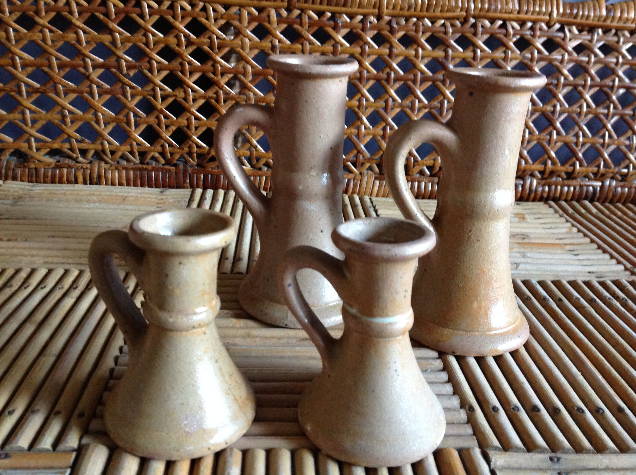 Set of 4 candlesticks in sandstone