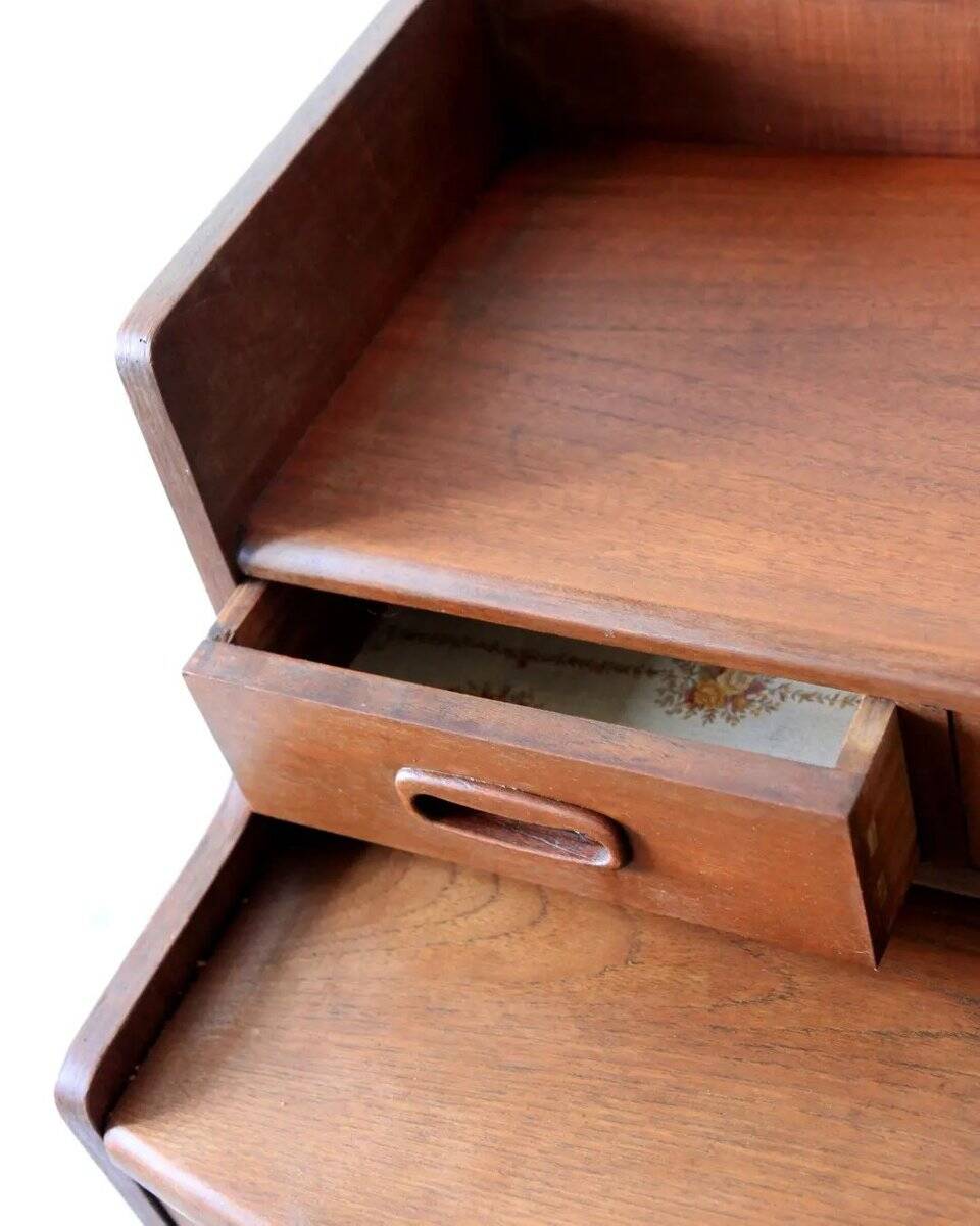Mid-century teak dressing table in curved brown with sliding mirror and 6 drawers.