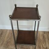 Pedestal table in leather and metal