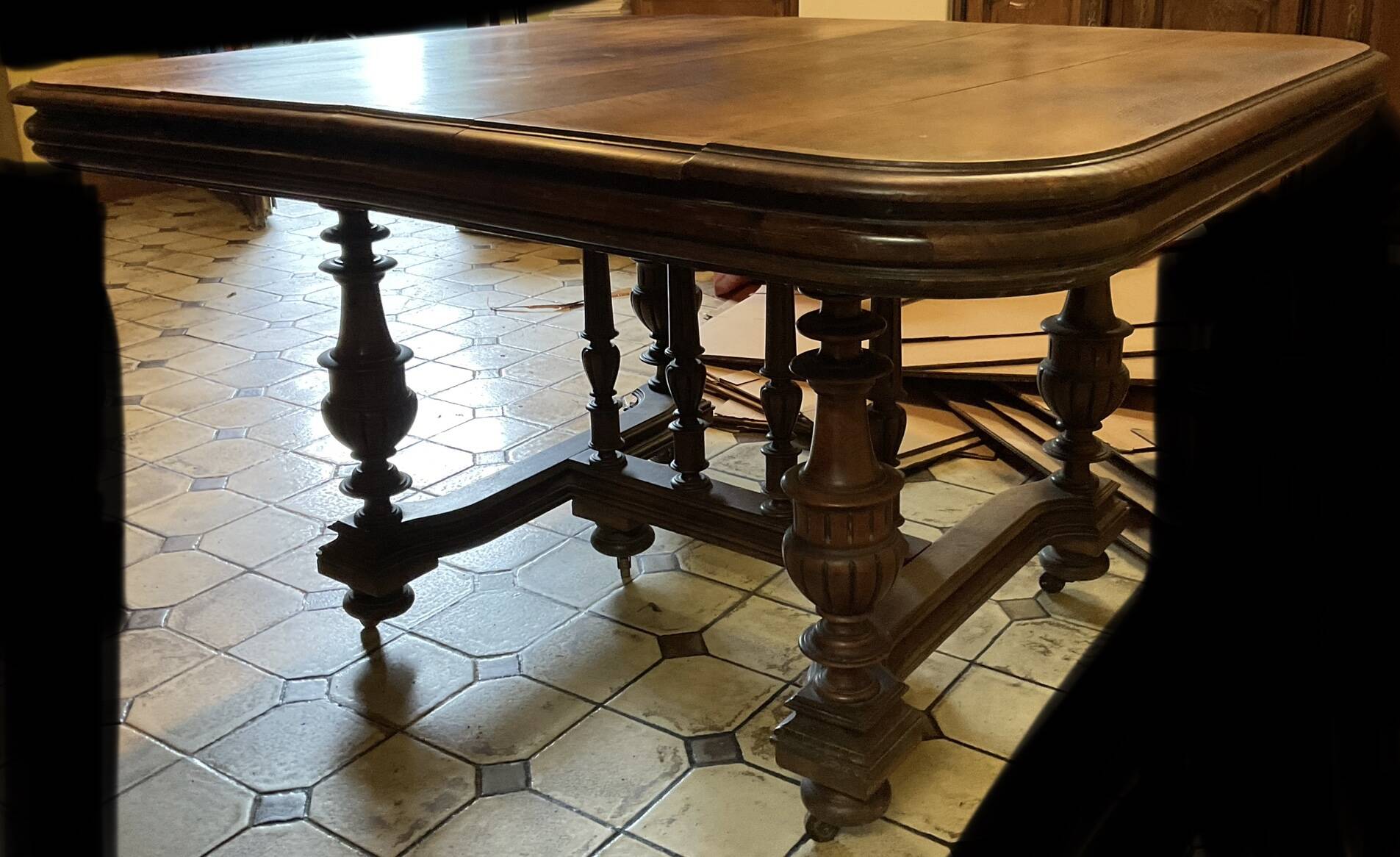 Extendable wheeled table henri ii, second half of the 19th century, solid walnut.