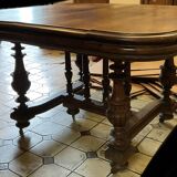 Extendable wheeled table henri ii, second half of the 19th century, solid walnut.