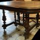 Extendable wheeled table henri ii, second half of the 19th century, solid walnut.