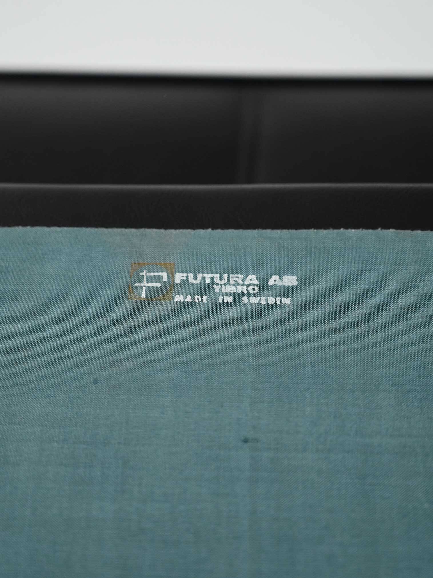 Swedish AB Futura teak and faux leather armchair