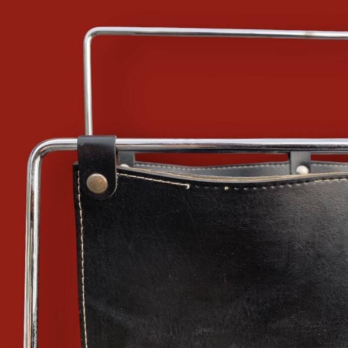 Pair of magazine racks in chromed metal and black leatherette, 1970s