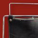 Pair of magazine racks in chromed metal and black leatherette, 1970s