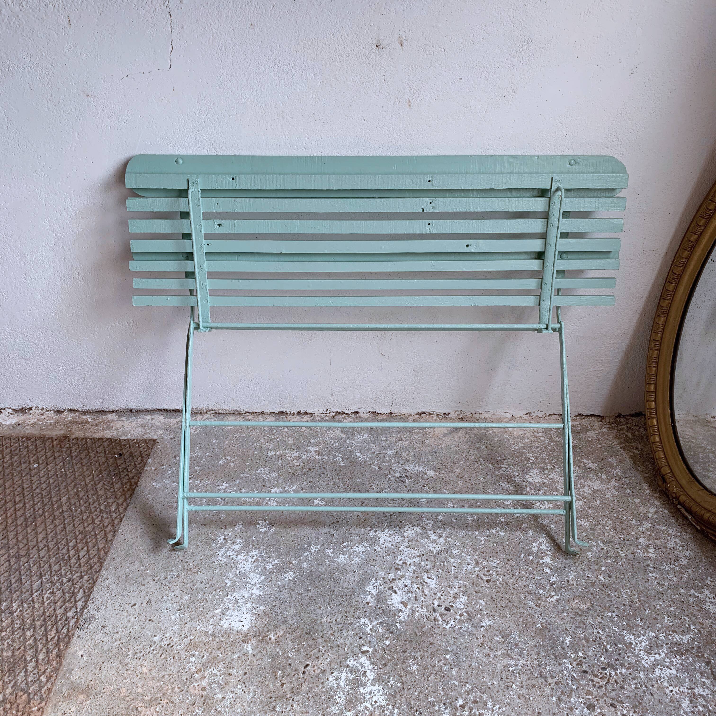 Former folding garden bench with wooden and metal slats