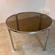 Table ronde vintage tubulaire en métal et verre fumé design année 70
