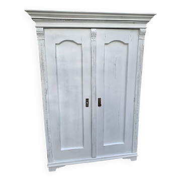 Vintage two-door wardrobe in painted white wood — late 19th century Hungarian style.