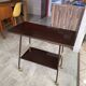 TV stand on casters, 2 brown Formica shelves, 1960s
