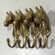 Brass horses coat hooks 1960’s, set of 4