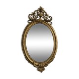 Miroir ovale doré à la feuillle