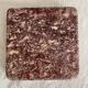 Pink marble trivet with brass ball feet.