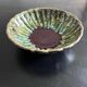 Deep, corrugated, flame-patterned dish
