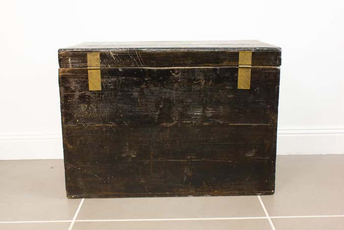 Brown and gold lacquered Chinese chest decorated with flowers circa 1900